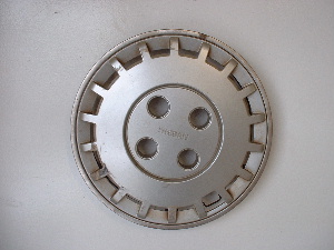 87 Stanza hubcaps
